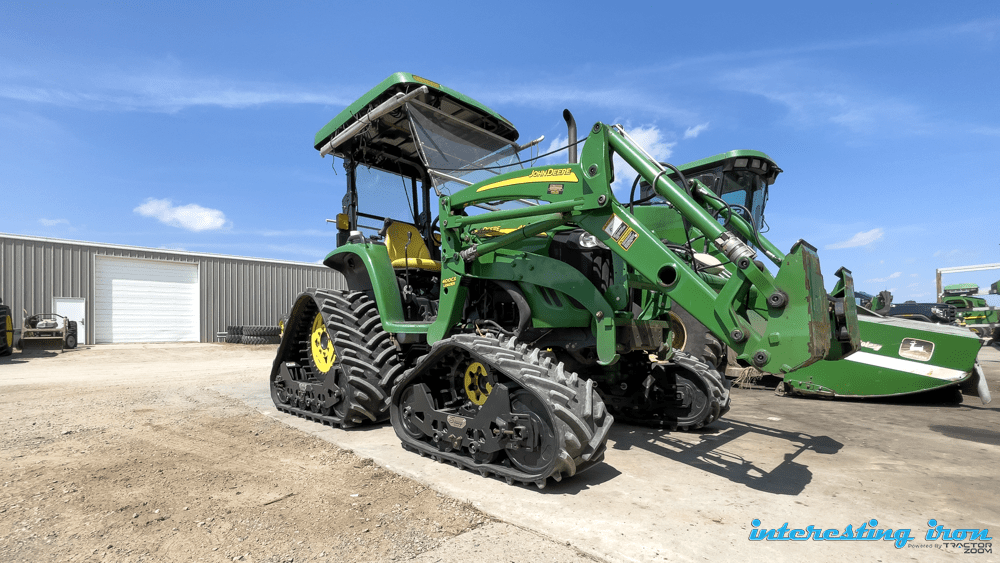 John Deere tractor with treads and bucket