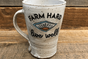 White pottery mug with Farm Hard Live Well saying